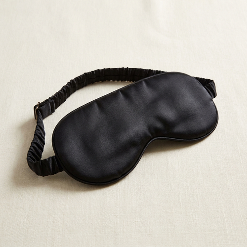 Midnight black silk eye mask three-quarter angle with strap detail